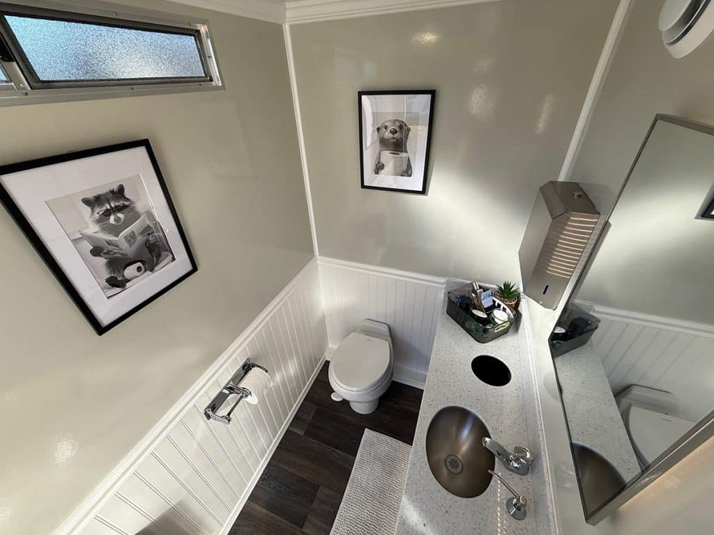 Modern bathroom with animal artwork.