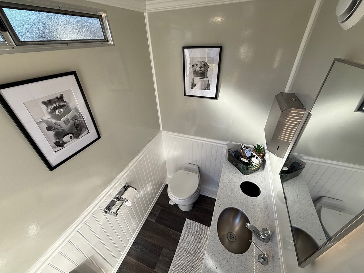 Modern bathroom with animal artwork.