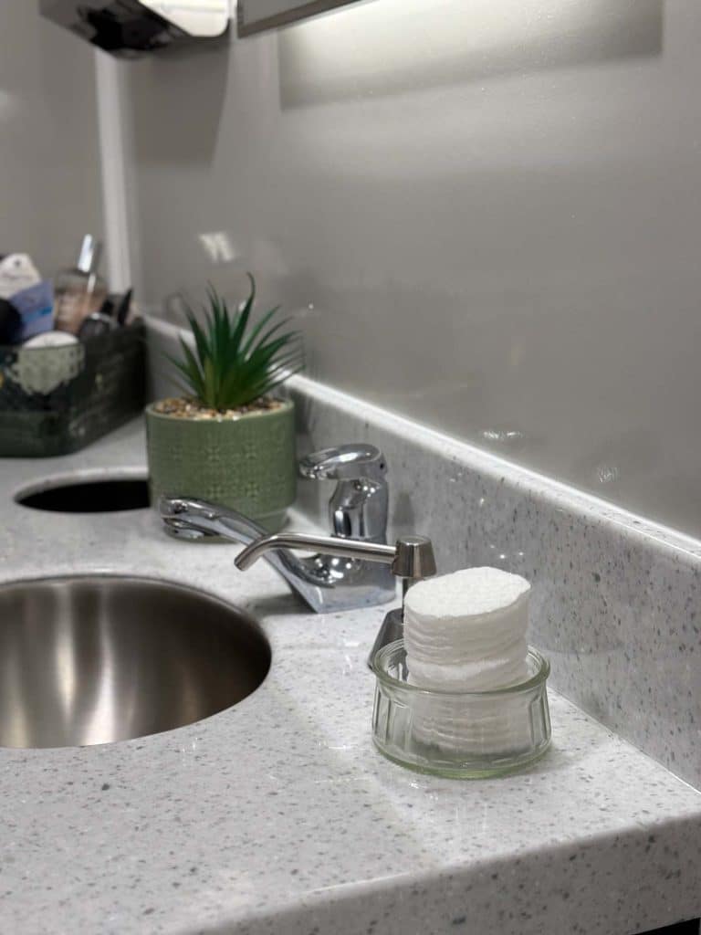 Clean bathroom sink with toiletries.