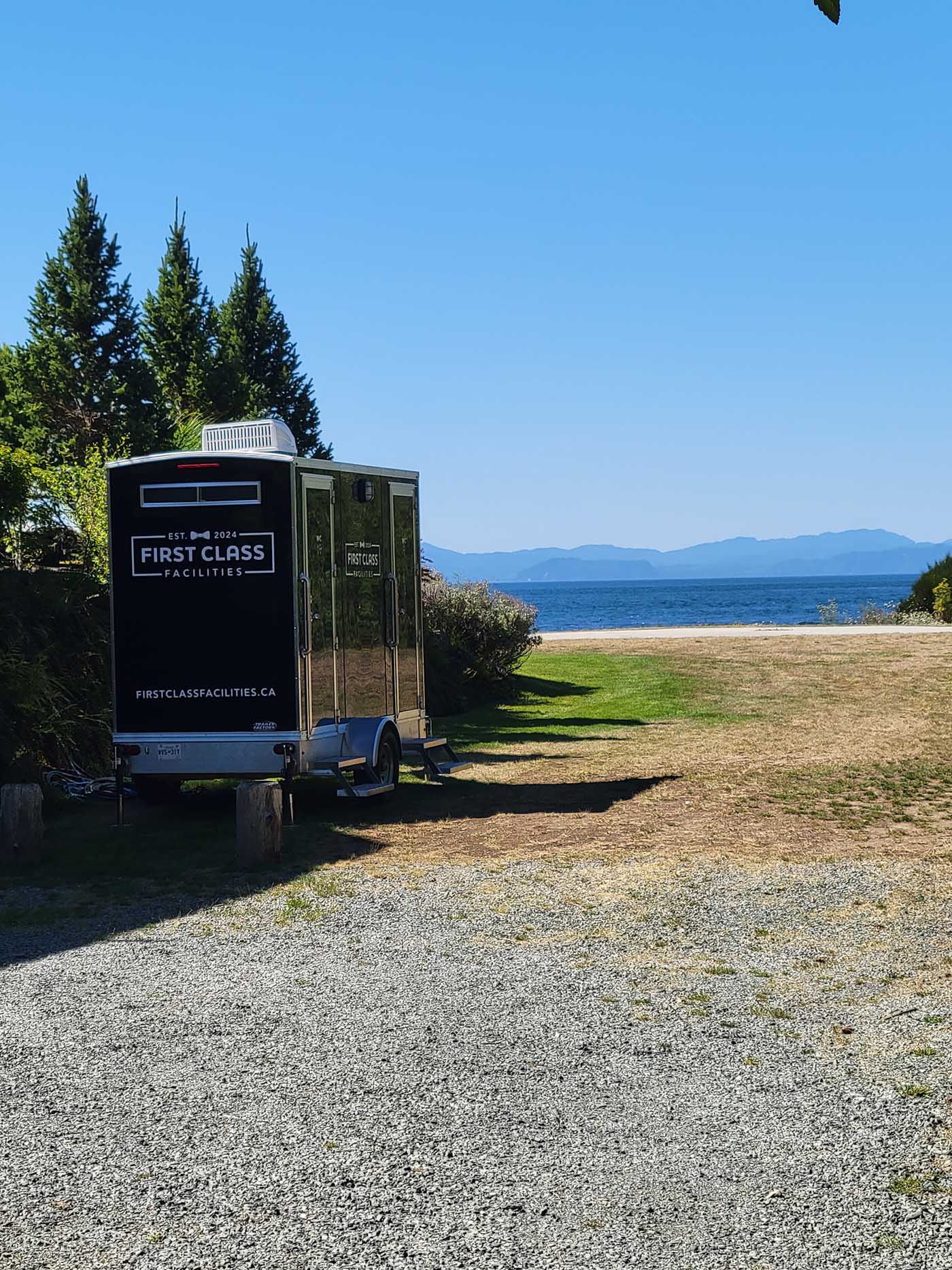 Portable restroom by scenic waterfront