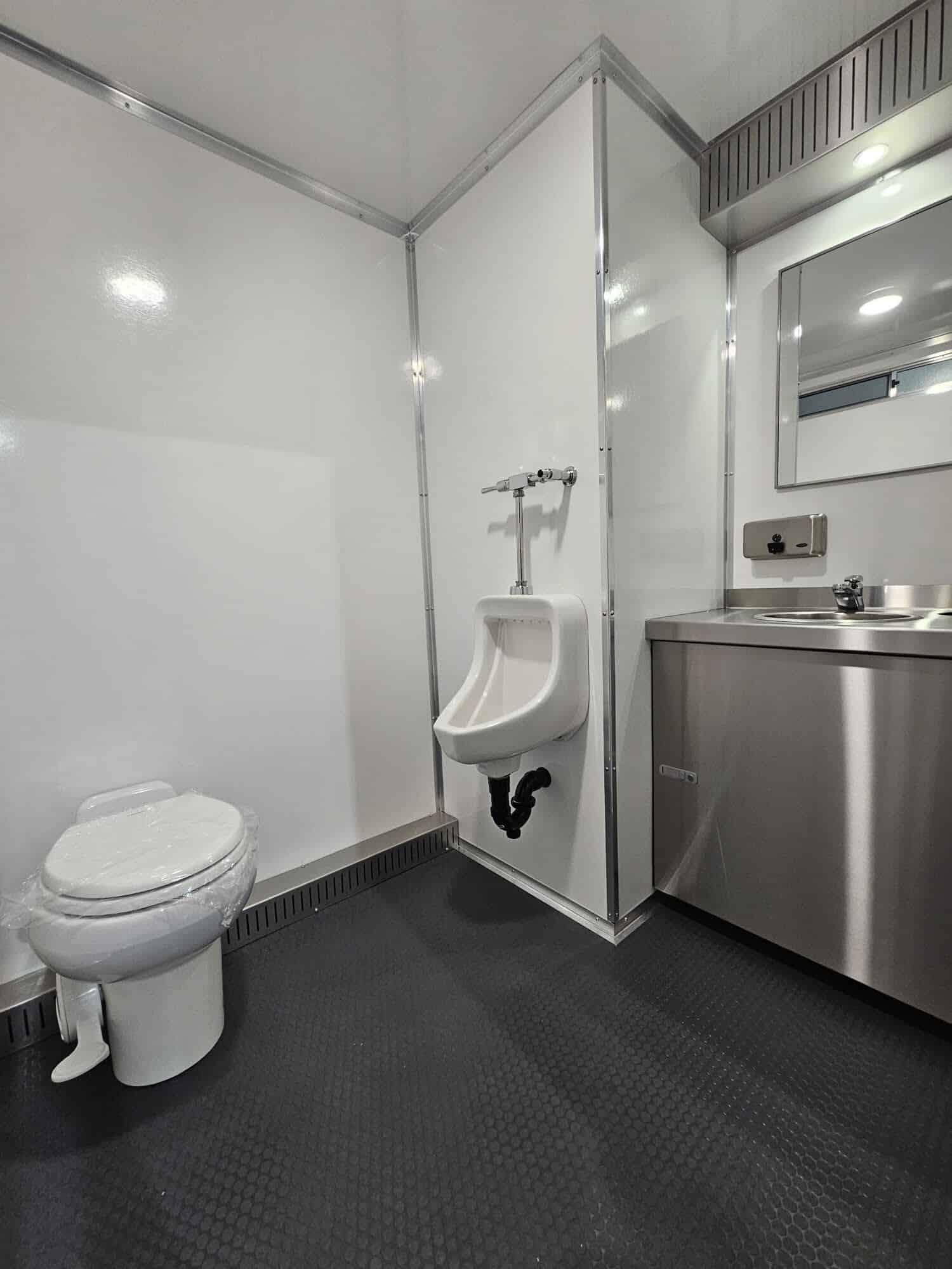 Modern restroom with toilet and urinal