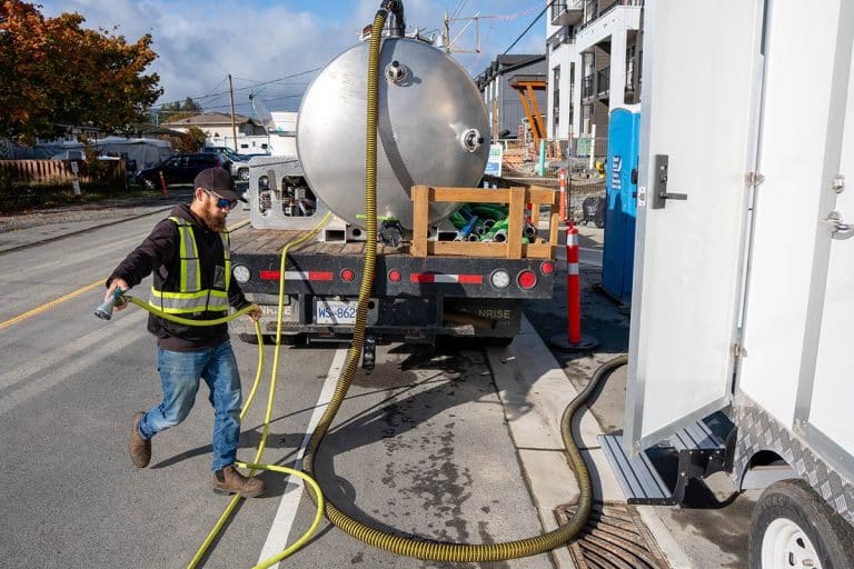 Worker operating equipment on site – Septic Services on Vancouver Island