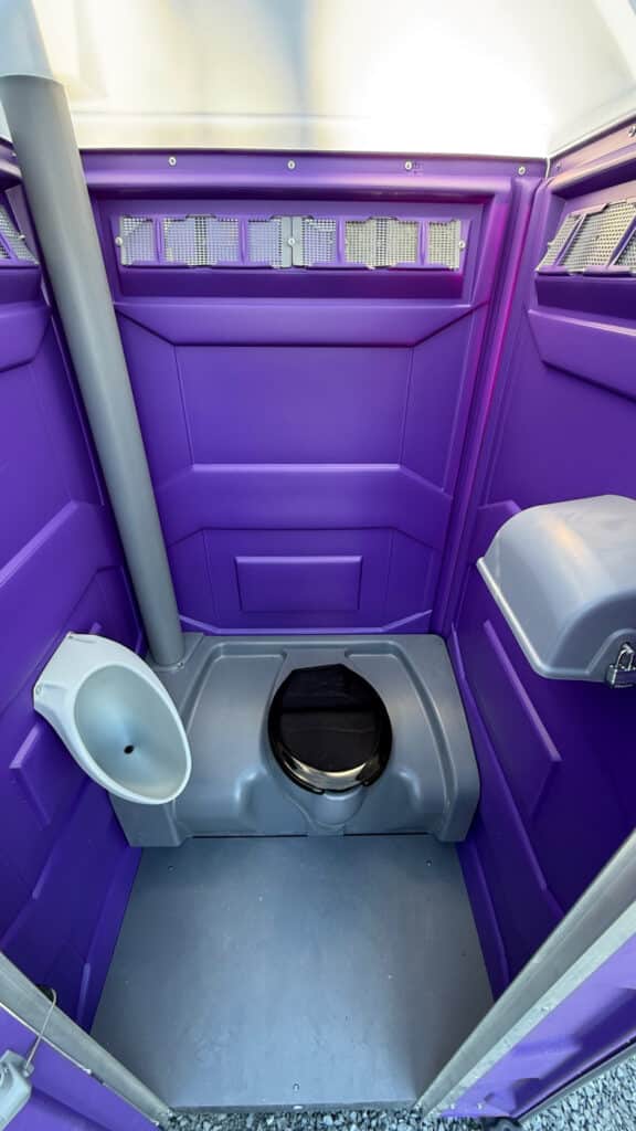 Interior of a purple portable toilet