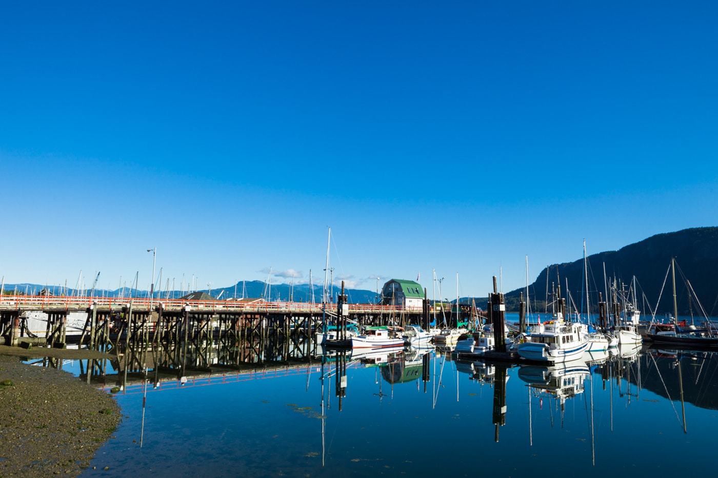 Calm marina with boats and reflections at the marina in Cowichan Bay on Vancouver Island of British Columbia