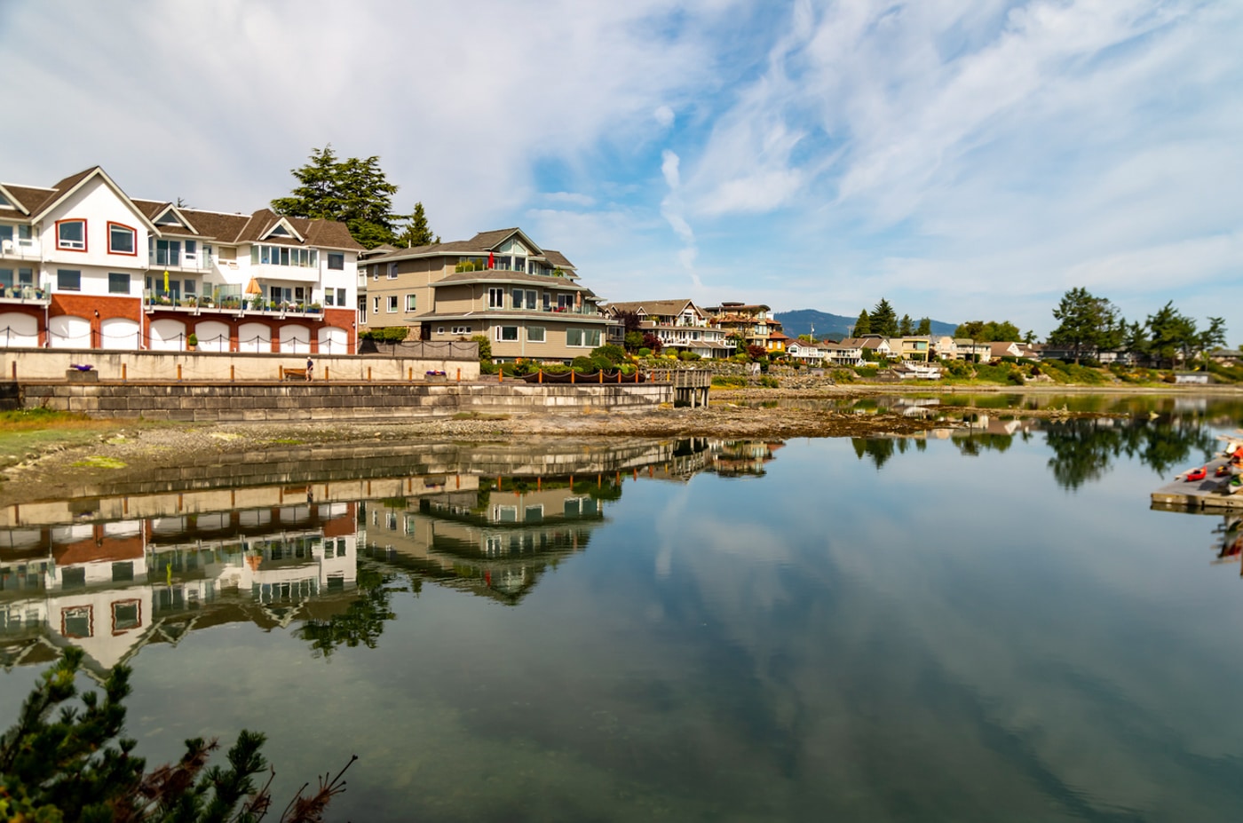 Scenic waterfront with reflections of buildings Sidney, BC