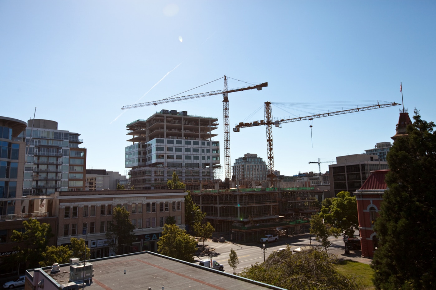Urban construction with cranes and buildings