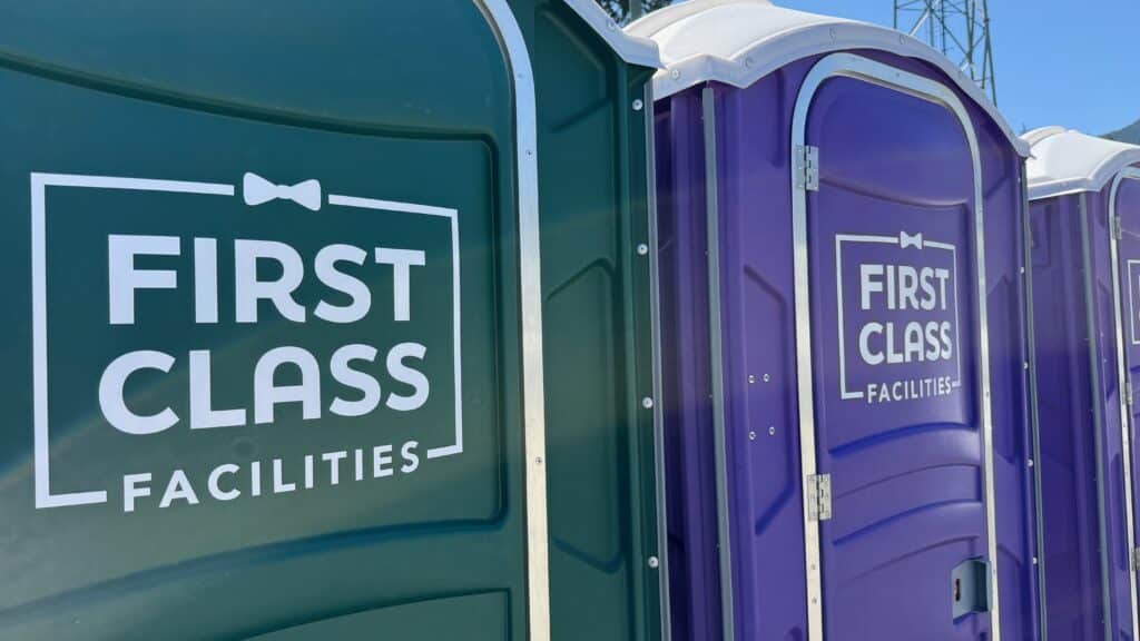 Porta potty rental cost in Nanaimo — First Class Facilities unit at a Departure Bay construction site